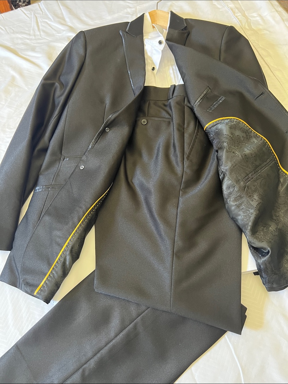 Men's Black Three-Pieces tuxedos. 
Jacket, shirt & Pants